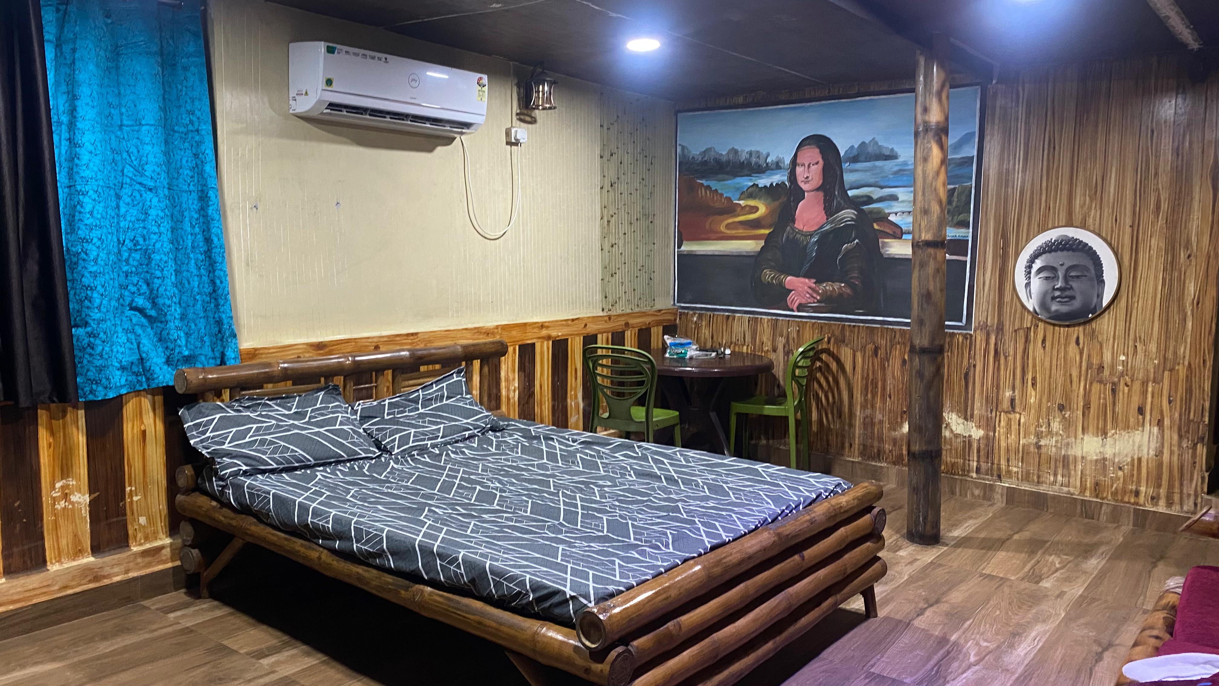 Bamboo-style room with bed and wall art