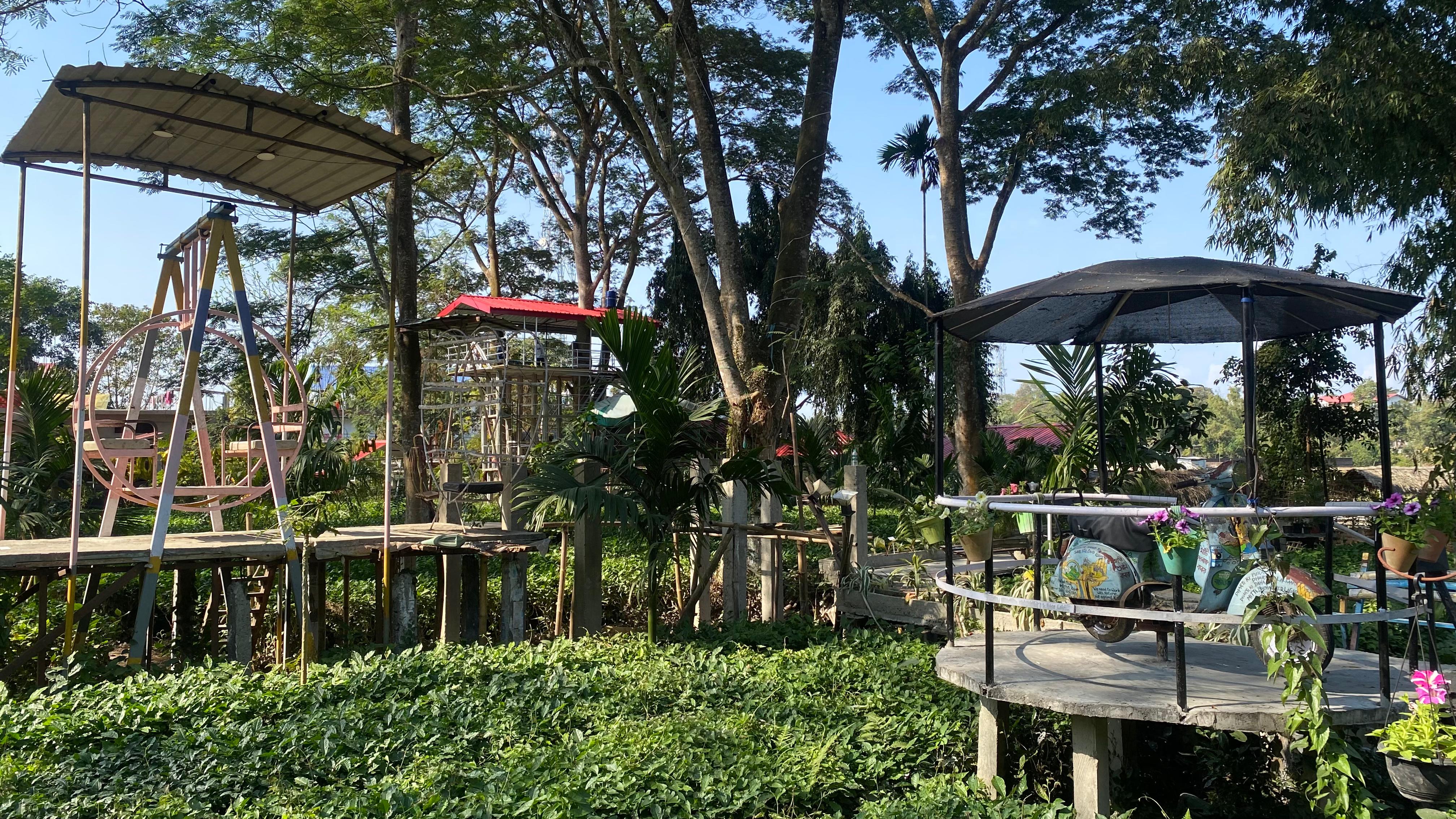 Open garden decks with seating and trees in daylight