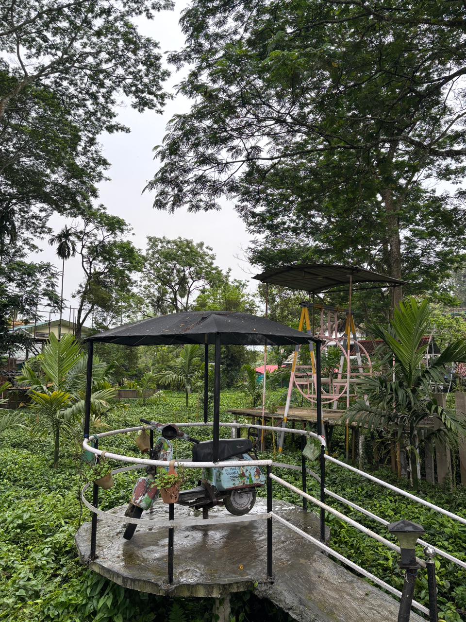 Garden seating deck with a decorative scooter